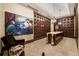 Stunning wine cellar with individual storage, marble table, art piece, and chandelier lighting at 7600 Landmark Way # 904, Greenwood Village, CO 80111