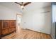 Bedroom with hard floors, a closet, and natural light at 2300 Willow Ln, Lakewood, CO 80215