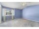 Spacious bedroom with light blue walls and carpeted floors at 1805 W 101St Ave, Thornton, CO 80260