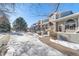 Townhome community with snow-covered sidewalks and landscaping at 1805 W 101St Ave, Thornton, CO 80260