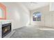 Living room with fireplace and large window at 1805 W 101St Ave, Thornton, CO 80260