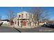 Two-story home featuring a flat roof, stucco siding, with street and neighborhood views at 3700-3704 Osage St, Denver, CO 80211