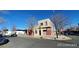 Two-story home featuring a flat roof, stucco siding, with street and neighborhood views at 3700-3704 Osage St, Denver, CO 80211