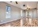 Spacious living room boasting modern flooring, neutral paint, and an open layout to other rooms at 3700-3704 Osage St, Denver, CO 80211