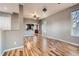 Spacious living room boasting modern flooring, neutral paint, and an open layout to other rooms at 3700-3704 Osage St, Denver, CO 80211