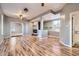 Open-concept living room featuring modern flooring, neutral paint, and an open layout to other rooms at 3700-3704 Osage St, Denver, CO 80211