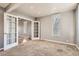 Open living space featuring a set of french doors and hardwood floors in the background at 3700-3704 Osage St, Denver, CO 80211
