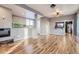 Open-concept living room featuring modern flooring, gray paint, fireplace, and an open layout at 3700-3704 Osage St, Denver, CO 80211