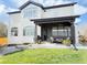 Spacious two-story home backyard with patio and manicured lawn perfect for entertaining at 19987 E Belleview Pl, Centennial, CO 80015