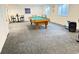 Large basement rec room featuring a pool table and plenty of open space at 19987 E Belleview Pl, Centennial, CO 80015