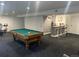 Open basement with a pool table and wet bar area perfect for entertaining and recreation at 19987 E Belleview Pl, Centennial, CO 80015