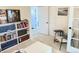 Bright bedroom featuring large bookcase for storage at 19987 E Belleview Pl, Centennial, CO 80015