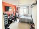 Comfortable bedroom with sports-themed decor, workspace, and cozy bed at 19987 E Belleview Pl, Centennial, CO 80015