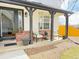 Inviting front porch with seating area and view of the home's entrance at 19987 E Belleview Pl, Centennial, CO 80015