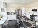 Modern kitchen features stainless steel appliances, sleek countertops, and ample storage space at 19987 E Belleview Pl, Centennial, CO 80015