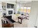 Cozy living room features built-in shelving, fireplace, and large windows for natural light at 19987 E Belleview Pl, Centennial, CO 80015