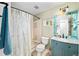 Well-lit bathroom with a vanity, decorative mirror, and a shower/tub combo with a patterned curtain at 3982 Arbol Ct, Boulder, CO 80301