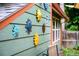 Exterior detail showcasing decorative sunbursts and siding on a charming home, enhancing its curb appeal at 3982 Arbol Ct, Boulder, CO 80301