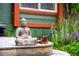Close-up of a Buddha statue on the wooden deck of the front porch at 3982 Arbol Ct, Boulder, CO 80301