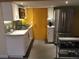 Modern kitchen with stainless steel refrigerator, white cabinets, granite counters and tiled backsplash at 3982 Arbol Ct, Boulder, CO 80301