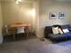 Cozy living room with wood table, couch, neutral walls and carpeting at 3982 Arbol Ct, Boulder, CO 80301