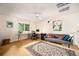 Upstairs loft used as an office space features vaulted ceilings, comfortable seating, and a large window at 3982 Arbol Ct, Boulder, CO 80301