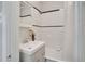 Updated bathroom features a bathtub and modern vanity at 1341 N Washington St # 4, Denver, CO 80203