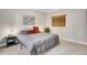 Cozy bedroom with a comfortable bed and decorative wall hangings at 1341 N Washington St # 4, Denver, CO 80203