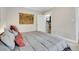 Spacious bedroom with a comfortable bed and decorative wall art at 1341 N Washington St # 4, Denver, CO 80203