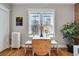 Small dining area with a drop-leaf table and chairs near a radiator at 1341 N Washington St # 4, Denver, CO 80203