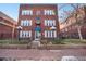 Attractive brick apartment building with landscaping and well-maintained grounds at 1341 N Washington St # 4, Denver, CO 80203