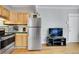 Modern kitchen with stainless steel appliances and wood cabinets at 1341 N Washington St # 4, Denver, CO 80203