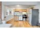Updated kitchen features stainless steel appliances and wood cabinets at 1341 N Washington St # 4, Denver, CO 80203