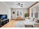 Bright and airy living room with hardwood floors and a view into the kitchen at 1341 N Washington St # 4, Denver, CO 80203