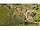 Aerial view of farm with barns, fenced paddocks, and surrounding fields at 13183 N 95Th St, Longmont, CO 80504