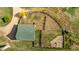 Aerial view of farm building with fenced paddock and surrounding fields at 13183 N 95Th St, Longmont, CO 80504