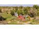 Aerial view of farm with barns, fenced paddocks, and landscaping at 13183 N 95Th St, Longmont, CO 80504