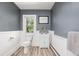 Cozy bathroom with neutral paint, updated toilet and wood-look tile at 13183 N 95Th St, Longmont, CO 80504