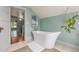 Elegant bathroom showcases a modern freestanding bathtub and serene ambiance at 13183 N 95Th St, Longmont, CO 80504
