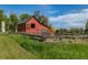 Picture of a red barn surrounded by fencing at 13183 N 95Th St, Longmont, CO 80504