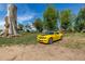 A yellow sports car is parked on the expansive property at 13183 N 95Th St, Longmont, CO 80504