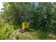 Yellow beehive box sitting near lush greenery at 13183 N 95Th St, Longmont, CO 80504