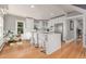 Bright, modern kitchen with an island, stainless steel appliances, and hardwood floors at 13183 N 95Th St, Longmont, CO 80504