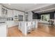 Spacious kitchen featuring a large island with seating and stainless steel appliances at 13183 N 95Th St, Longmont, CO 80504