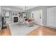 Bright living room with fireplace, hardwood floors, modern lighting and neutral paint at 13183 N 95Th St, Longmont, CO 80504