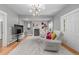 Cozy living room featuring a fireplace, hardwood floors, and large windows at 13183 N 95Th St, Longmont, CO 80504