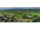 Wide aerial view of green pastures and distant mountains showcasing a vast and serene landscape at 1705 Stonehenge Dr, Lafayette, CO 80026