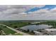 Aerial view featuring a lake, blue sky, and community at 1705 Stonehenge Dr, Lafayette, CO 80026