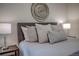 Close up on a king bed with an accent wall at 1705 Stonehenge Dr, Lafayette, CO 80026