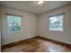 Bedroom with hardwood floors, natural light, and neutral paint at 1705 Stonehenge Dr, Lafayette, CO 80026